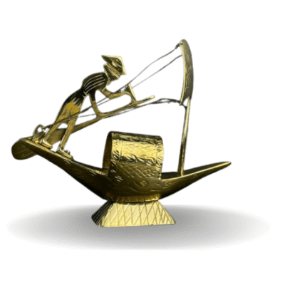 Brass boat with sailor